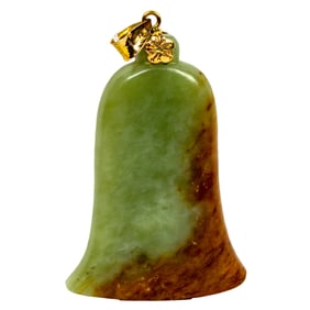 A Chinese russet jade and celadon jade pendant