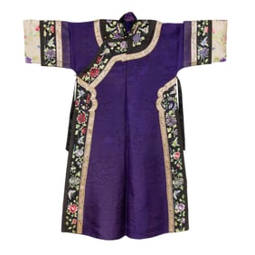 A Chinese purple ground woven brocade informal robe