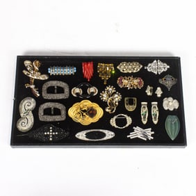Twenty-two Art Deco, Art Nouveau-style and Art Deco style brooches, earrings and shoe clips