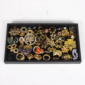 Forty-three costume jewelry brooches including Kirks Folly, Monet, Miriam Haskell and others
