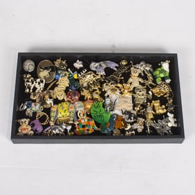 Forty-nine costume jewelry brooches of teddy bears, elephants and cats