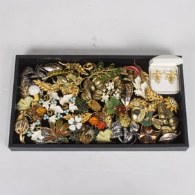 Fifty costume jewelry brooches of foliage and fruits, comprising Sarah Coventry, Michael Michaud,