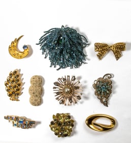 Forty-six costume jewelry brooches