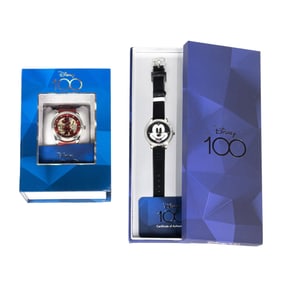 Two Disney 100 Mickey Mouse watches with leather bands, one with crystal bezel, both with original