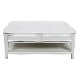 A large white painted quatrefoil coffee table