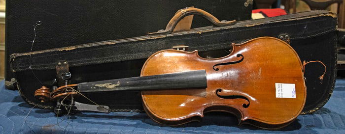 A violin in case with two bows
