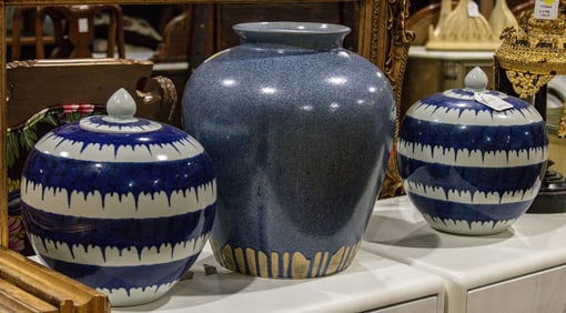 A group of three ceramic jars