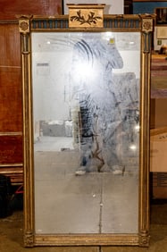 A Neoclassical style polychrome and giltwood mirror