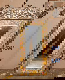 A Spanish polychrome and gilt wall mirror