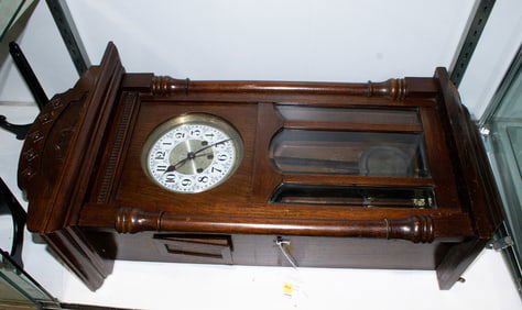 An American oak wall clock