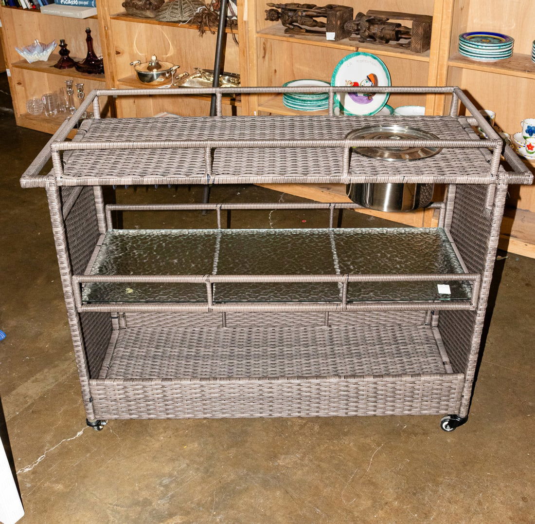 A contemporary three tier woven outdoor bar cart fitted with icebucket: A contemporary three tier woven outdoor bar cart fitted with icebucket, 36"h x 17.5"w x 49"l