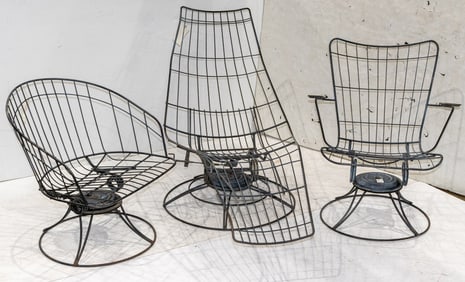An assembeld suite of three Mid-Century modern wire swivel lounge or arm chairs