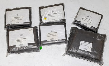 A group of six Restoration Hardware grey outdoor furniture covers