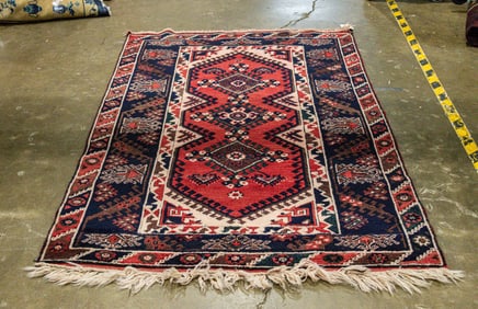 An Afghan carpet, 3'11" x 6'7"