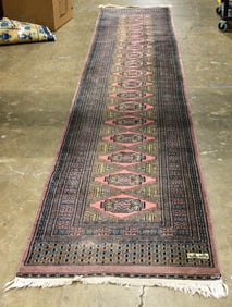 A signed Pakistani Bokhara runner, 2'7" x 13'4"