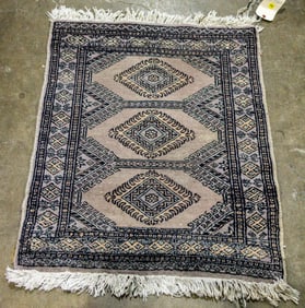 A Pakistani carpet, 2'1" x 2'8"