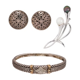 A group of silver jewelry