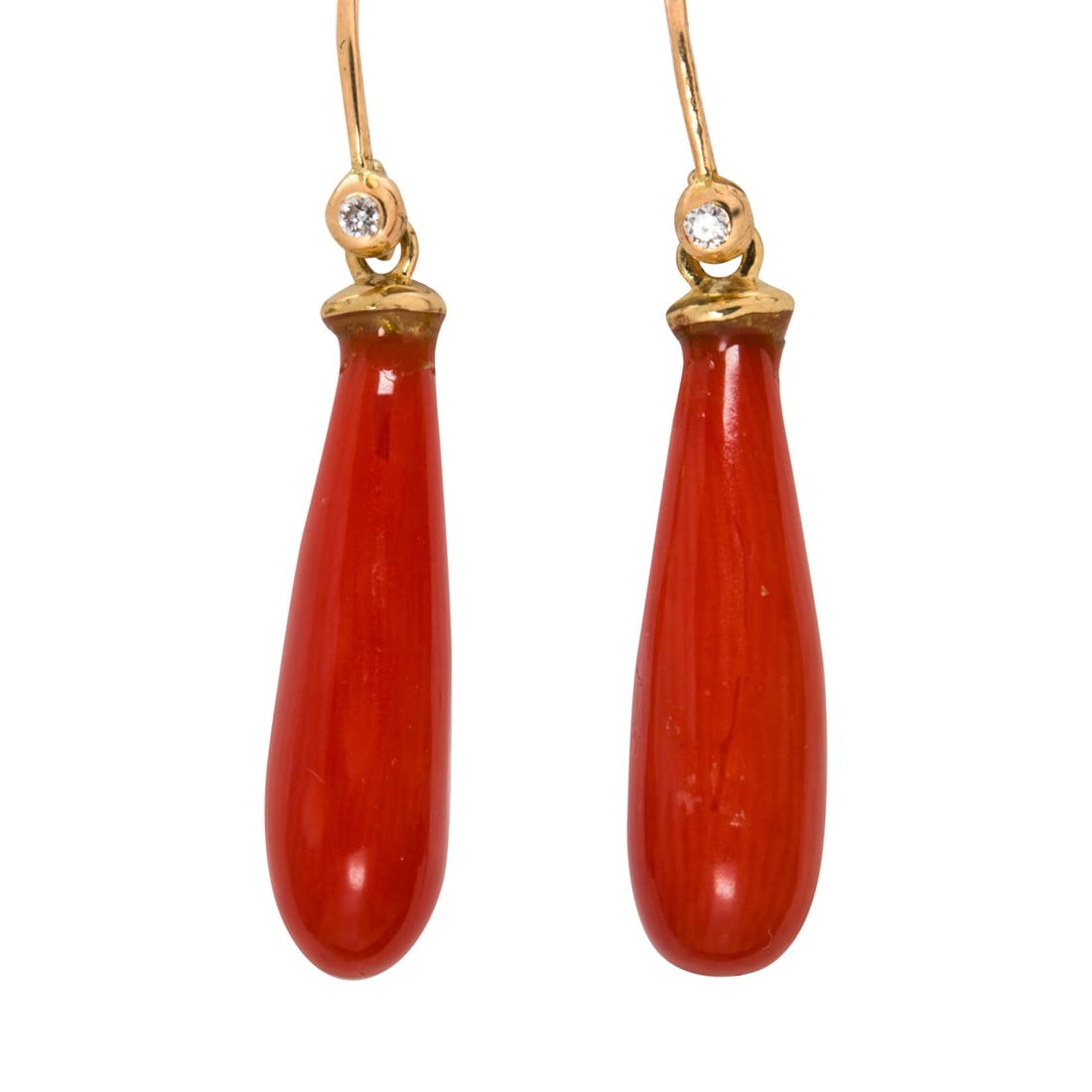 A pair of coral, diamond, and 14k gold earrings: A pair of coral, diamond, and 14k gold earringsDesigned with coral drops measuring approximately 19.83 x 6.83 mm, accented by one round brilliant-cut diamond; length: 1 1/4 in; 2.70 grams