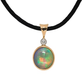 An opal, diamond, and 14k gold pendant