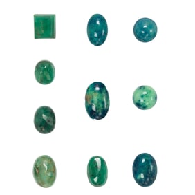 A group of emerald and hardstone cabochons