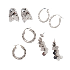 Four pairs of 14k white gold earrings