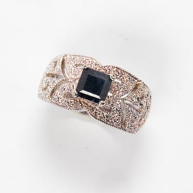 A sapphire and silver ring