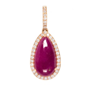 A ruby, diamond, and 18k gold pendant