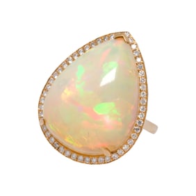 An opal, diamond, and 18k gold ring