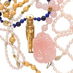 A group of five beaded and metal necklaces