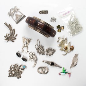 A group of silver jewelry