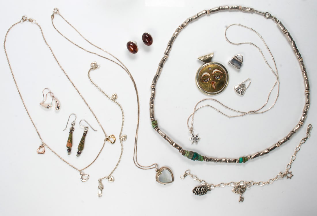 A group of silver and hardstone jewelry: A group of silver and hardstone jewelrycomprising one pendant, two pendant necklace, two necklace, two charms, three pairs of earrings, and two chain bracelets; 120.00 gross grams