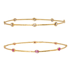 A pair of ruby, diamond and 18k gold bangle bracelets