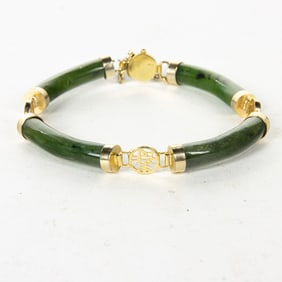 A jade and gold plated metal bracelet