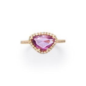 A pink sapphire, diamond and 14k gold ring