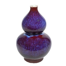 A Chinese flambe glazed double gourd vase