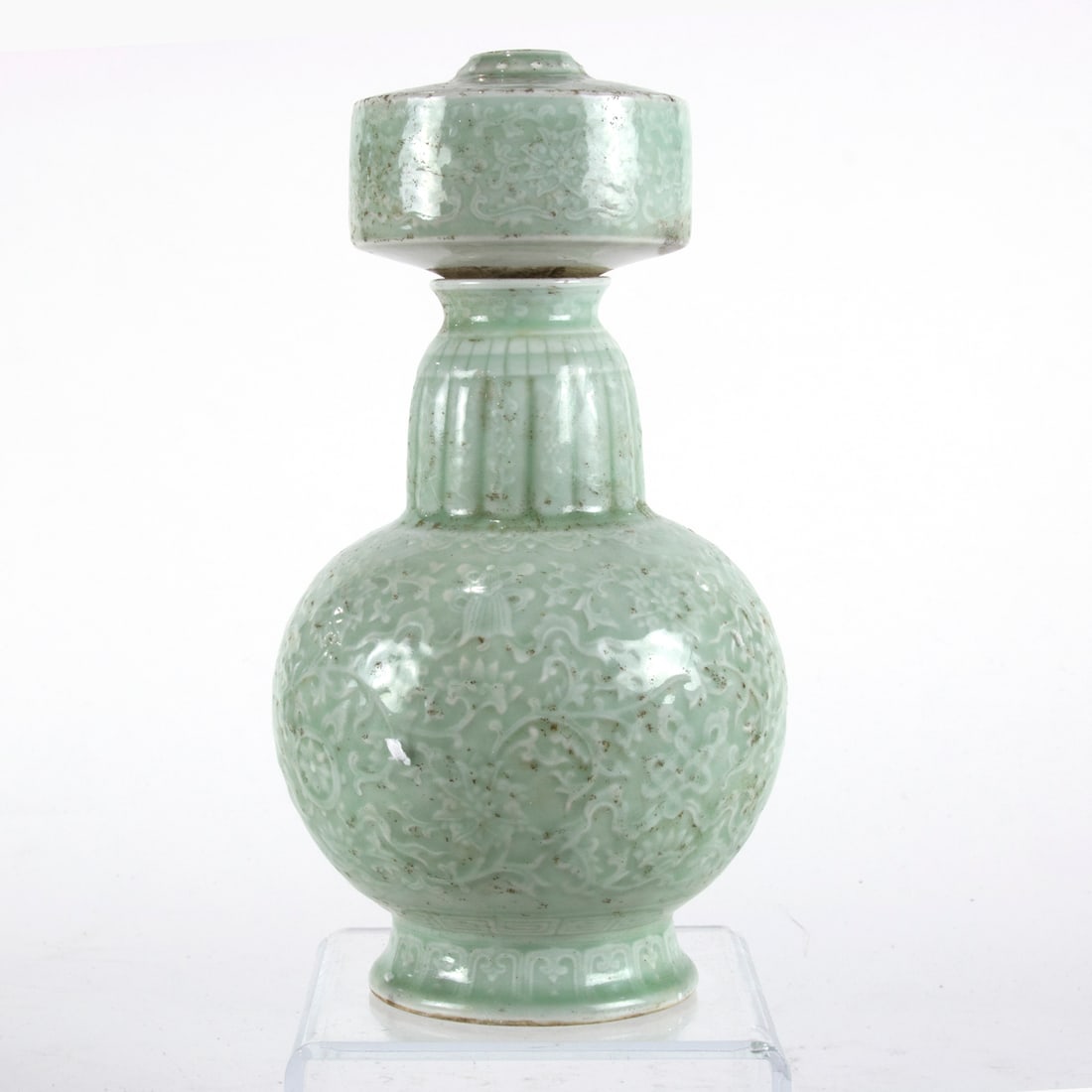 A Chinese celadon glazed vase: A Chinese celadon glazed vase. Featuring lotus design, bearing Qianlong six-character mark, 11.375" high.