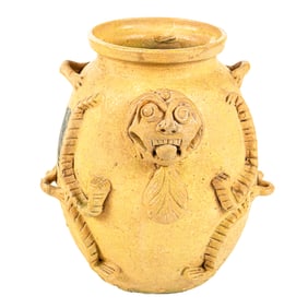 A Chinese straw glaze lion head with splashed spot water jar