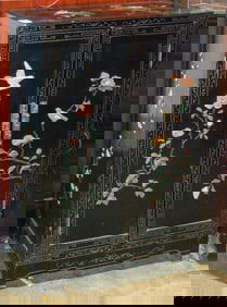 A Chinese black lacquered and hardstone inlaid cabinet