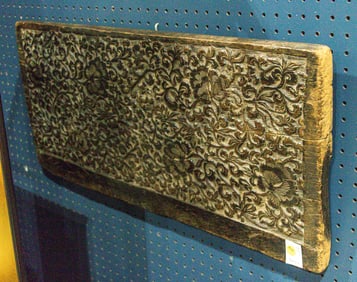 An Asian hardwood carved panel