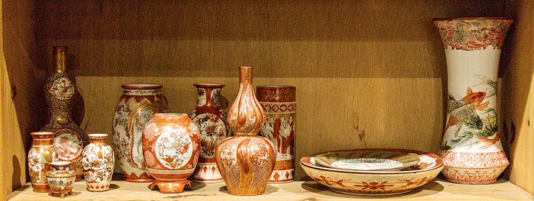 A shelf of Kutani objects: A shelf of Kutani objects. Meiji period, from 2.375" to 11.625" high.
