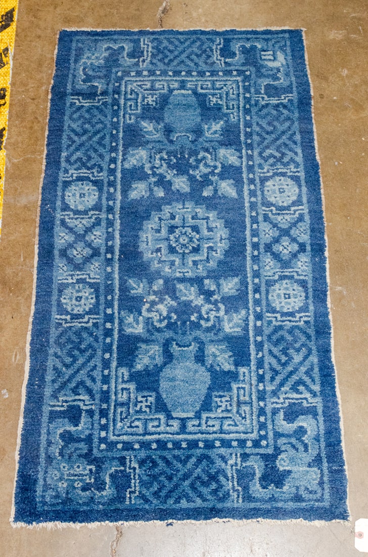 A Chinese Baotou rug: A Chinese Baotou rug. 2'2" x 4'.