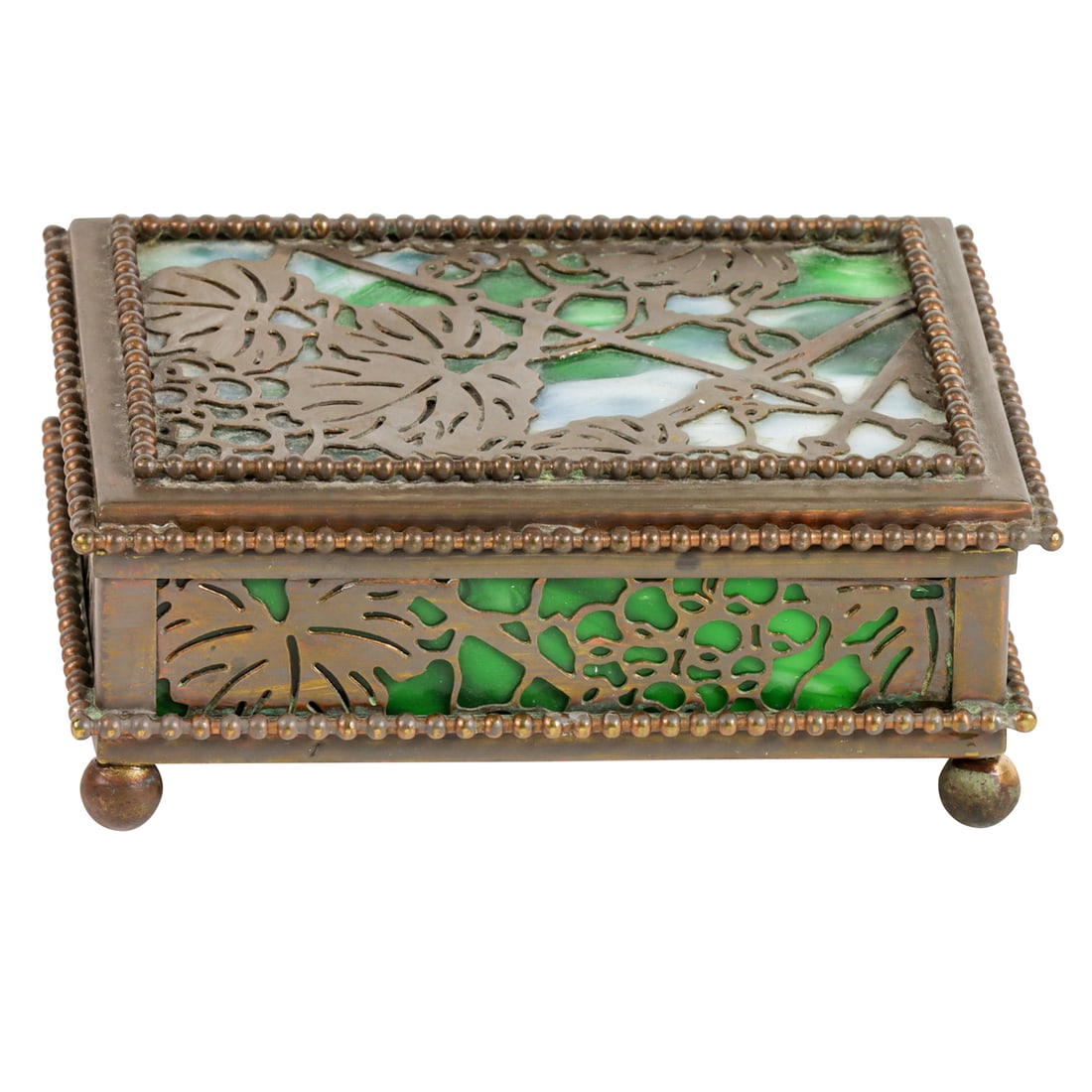 A Tiffany Studios patinated bronze and slag glass Grapevine pattern stamp box: A Tiffany Studios patinated bronze and slag glass Grapevine pattern stamp box, stamped 'TIFFANY STUDIOS, NEW YORK', 2"h x 4.5"l x 3.25"d