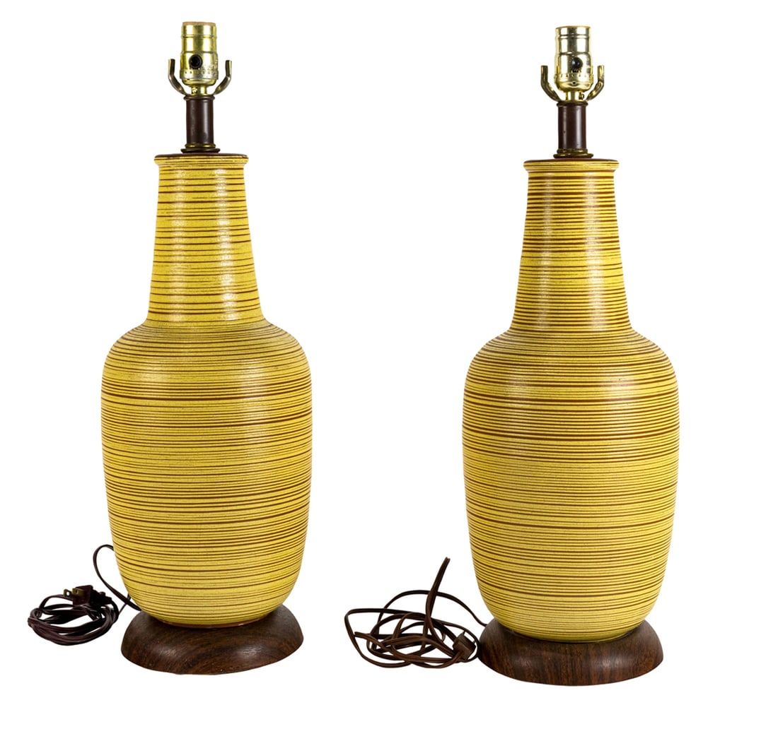 A pair of Mid-Century Modern ceramic table lamps in the manner of Design Technics: A pair of Mid-Century Modern ceramic table lamps, in the manner of Design Technics, each with yellow spiral glaze design, 20"h (excluding electrical fittings)