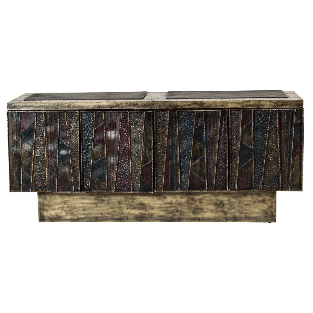 A Brutalist metal clad and welded deep relief sideboard in the manner of Paul Evans: A Brutalist metal clad and welded deep relief sideboard in the manner of Paul Evans, the front with two welded and enamel relief decorated accordion doors below the patchwork and slate top, unmarked,