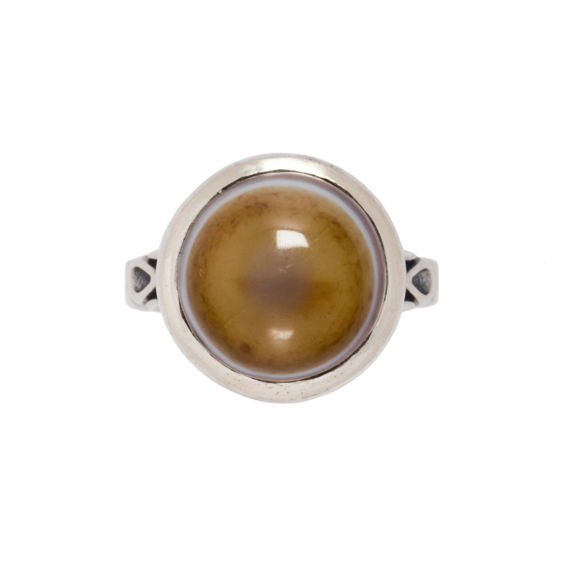 An agate and sterling silver ring: An agate and sterling silver ringFeaturing a round shaped agate cabochon measuring approximately 13.80 x 13.80 x 9.89 mm, set within sterling silver; size 8; 8.55 grams