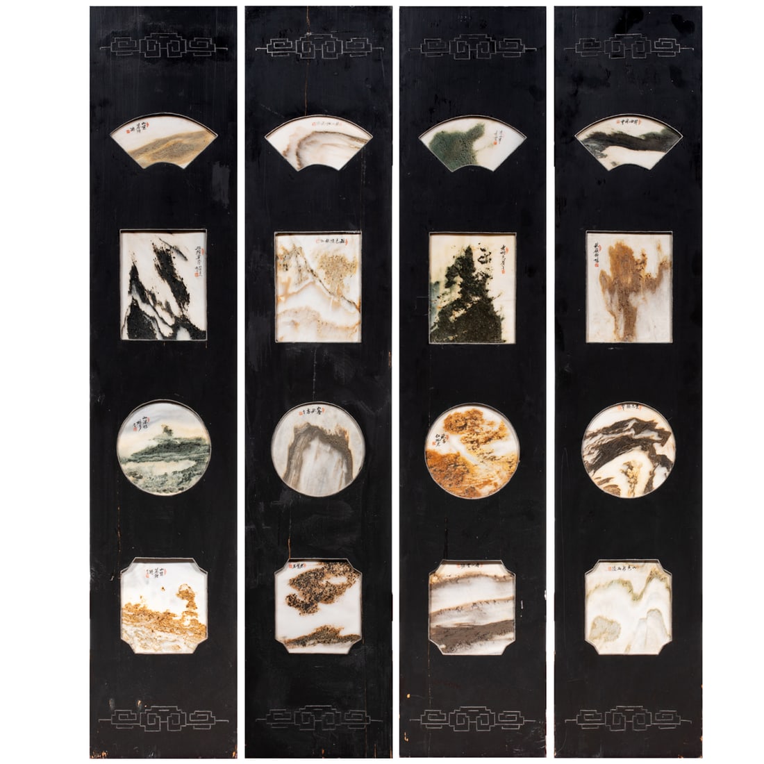 A set of four Chinese Dali marble plaque inset wall panels: A set of four Chinese Dali marble plaque inset wall panels. Comprising 16 marble plaques of various shapes, each inscribed and sealed, 52"h x 10.25"w of each panel.