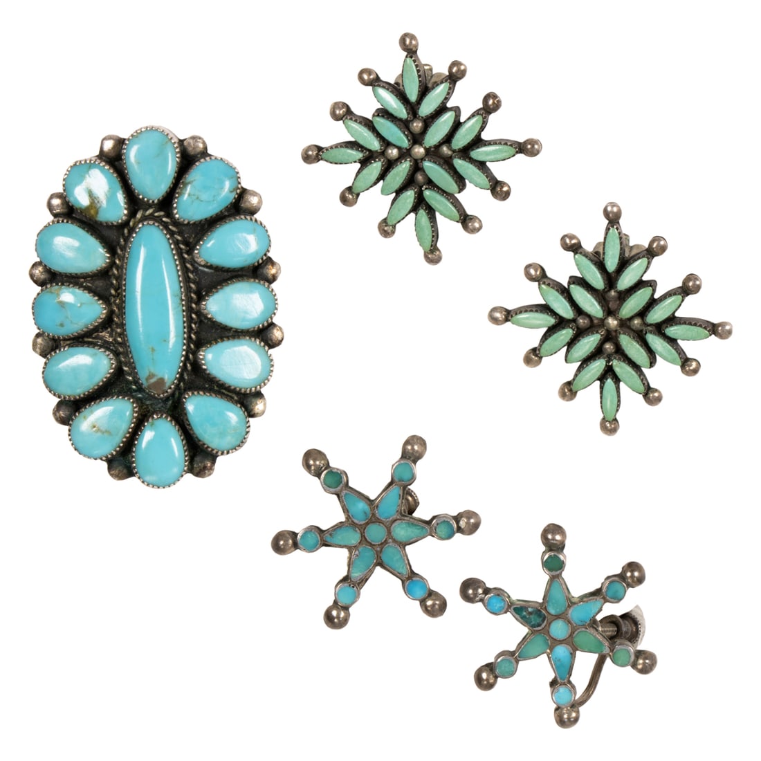 A group of turquoise and silver jewelry: A group of turquoise and silver jewelry Comprising two pairs of ear-clips and one ring set with turquoise cabochons; ring size: 8; gross weight: 22.15