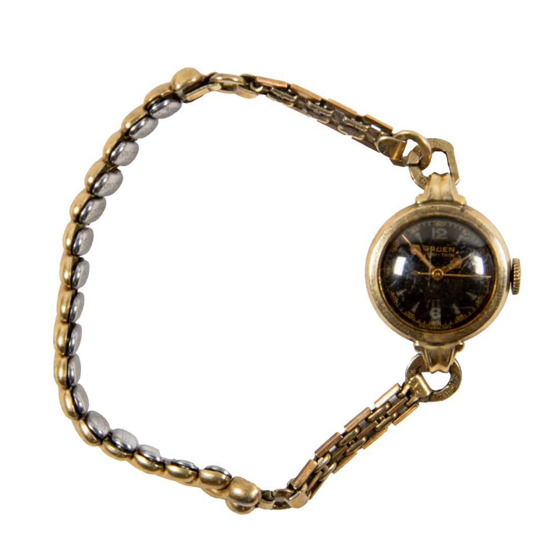 A Gruen 'Veri-Thin' cocktail watch: A Gruen 'Veri-Thin' cocktail watch The black tone face, no indices, gold breguet hands, within polished gold tone stainless steel case; case width: 15.37 mm; strap length: 7 in (expandable)