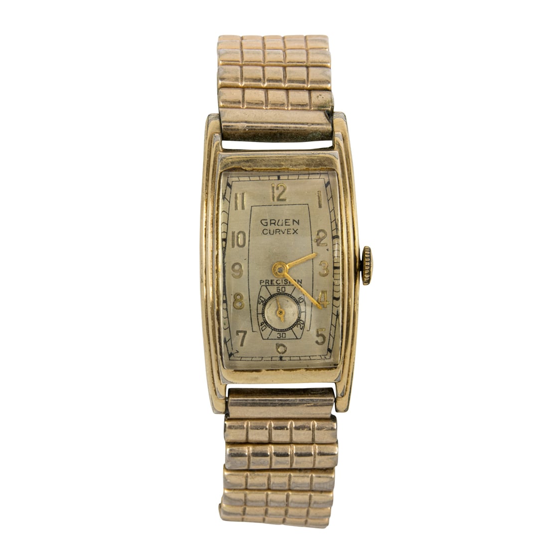 A Gruen Curvex watch: A Gruen Curvex watch The champagne tone dial, gold indices, gold stick hands, subsidiary dial, within gold-tone case; case width: 15.77 mm; strap length: 7 1/2 in (adjustable)