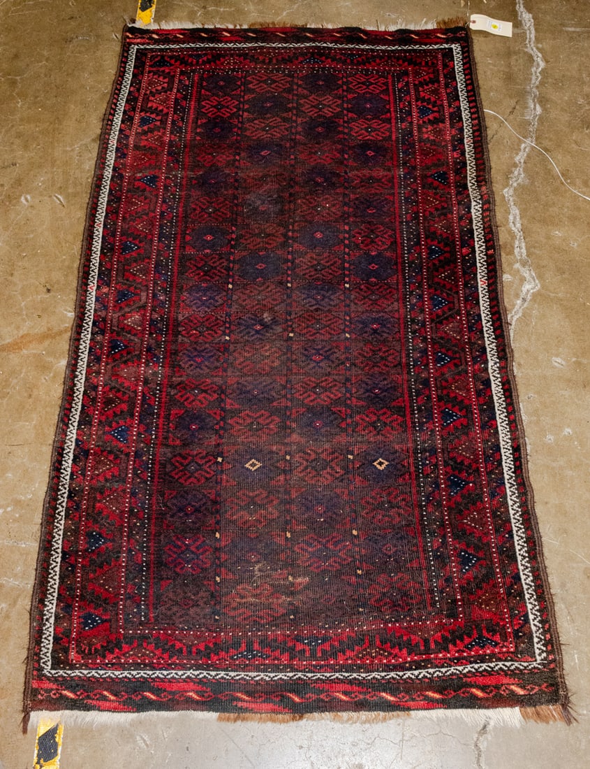 An Afghan rug: An Afghan rug. 3'3" x 5'11".